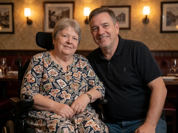 Hope and Daniel smiling together at a restaurant, a couple who met on LimitlessLove